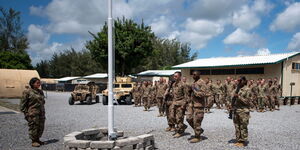 U.S. Air Force, airmen from the 475th Expeditionary Air Base Squadron conduct a flag-raising ceremony at Camp Simba, Manda Bay, Kenya on August 26, 2019.