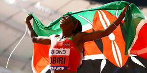 Kenyan Marathoner Hellen Obiri celebrates after winning a marathon