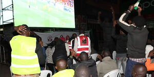 Kenyans enjoying a football match at a public viewing centre in Nairobi on November 21, 2022.