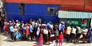 Kenyans queueing in the streets of Nairobi.