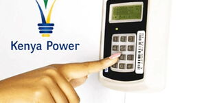 Undated image of a person inputting Kenya Power tokens in their prepaid meter.