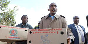 Kiambu Governor Kimani Wamatangi distributing chicks in Kiambu on July 2023