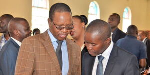 Former Interior PS Karanja Kibicho and former ICT CS Joe Mucheru engaged in a conversation during an event in Nyeri County on July 12, 2023. 