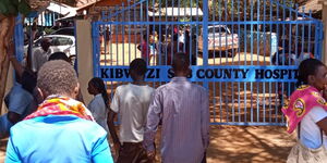 People mill outside Kibwezi Sub-County Hospital in Makueni County on February 28, 2019.