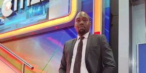 Inooro TV presenter Kihara wa Mwangi poses for a photo inside Citizen TV studios on December 9, 2021.