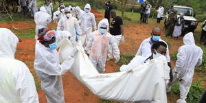 Security officers exhuming bodies at Shakahola graves in Kilifi County on Sunday, April 23, 2023.