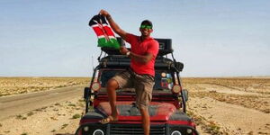 Kenyan motorist Kim Musau poses for a photo in Casablanca, Morocco on June 30, 2023. 
