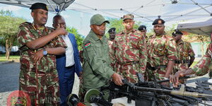 Interior CS Kithure Kindiki with senior officers at the Border Police Unit airstrip in Kanyonyo, Kitui County on November 25, 2022.