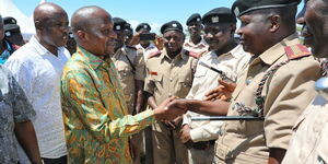 Interior CS Kithure Kindiki (left) received by senior police officers during graduation of National Police Reservists at Kimalel grounds, Baringo County on May 18, 2023.