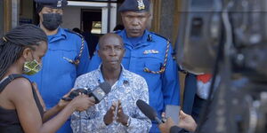 King Kafu releases a statement alongside police officers