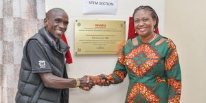 Two-time Olympics Marathon Winner Eliud Kipchoge and Isuzu East Africa Managing Director Rita Kavashe during a book donation to Eliud Kipchoge Library at Kapsisiywa Secondary School, Nandi County on May 25, 2024. Isuzu EA and Longhorn Publishers donated books in Science, Technology, Engineering and Mathematics (STEM) subjects worth KSh1 million.