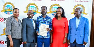 Kisumu Governor Anyang' Nyong'o (center) during the launch of a biometric time attendance and access control system.
