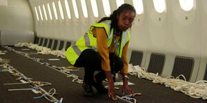 Kenya Airways development engineer Hazel Wachira in a repurposed aircraft for cargo in Nairobi on Thursday, February 25.
