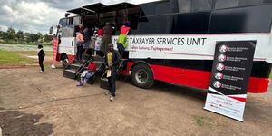Residents of Nakuru lining up to seek services from the Kenya Revenue Authority mobile services on November 24, 2023 