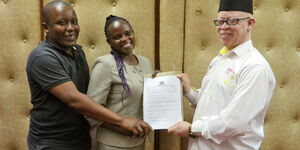 Government Spokesperson Isaac Mwaura with Ken Gitungo with His wife Magdalene.