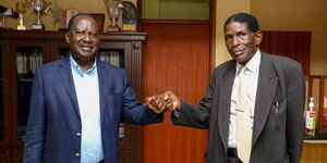Former Bumula MP Lawrence Sifuna (right) with Azimio Leader Raila Odinga.