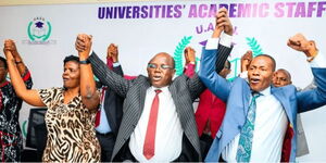 Lecturers singing solidarity songs after holding a press conference in October, 2025.