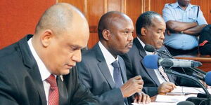 Former IEBC commissioners Thomas Letangule (centre), Mohamed Alawi (left)  and Yusuf Nzibo (right)