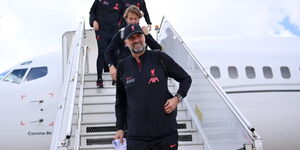 Liverpool manager Jurgen Klopp alighting from a plane