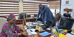 Treasury Cabinet Secretary Njuguna Ndung'u and Nnenna Nwabufo, Director General for Regional Development and Business Delivery of East Africa at the African Development Bank, signing the loan agreement in Nairobi on Wednesday May 3, 2023
