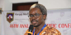 Dr Lukoye Atwoli addresses a gathering at a conference in 2019 in Nairobi 