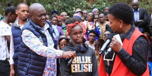 Machakos Governor Wavinya Ndeti interacting with a student at an event on Wednesday August 30, 2023