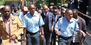 Ex-Mungiki leader Maina Njenga was escorted by police officers at the Nakuru Law Courts on Wednesday, May 24, 2023.