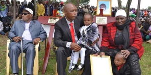 Former Mungiki leader Maina Njenga (centre) during the burial of his second wife Melisa Wairimu.