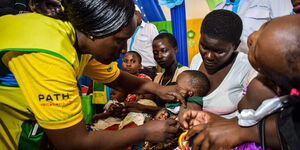 A health worker vaccinating a child against malaria in Ndhiwa, Homabay County on September 13, 2019. Must