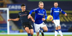 Man City midfielder Rodri Hernandez (left) battles for the ball with Everton's Tom Davies in a 2020 EPL match. 