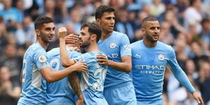 An undated photo of Manchester City players, coached by Pep Guardiola, celebrating a goal in a past match. 