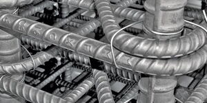 A photo of markings on steel reinforcement bars. 