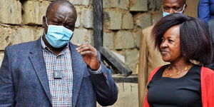 Interior CS Fred Matiang'i (left) with Mirimani sub-chief Patricia Wandia (right) on July 3, 2020.
