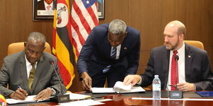 Minister of Finance, Planning and Economic Development Matia Kasaija (left) with US Ambassador to Uganda William W. Popp signing the Health Cooperation Framework at the US Embassy, Uganda on Wednesday, December 10, 2025