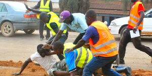 A photo of an angry mob attacking a suspected thief in Nairobi in July 2022. 