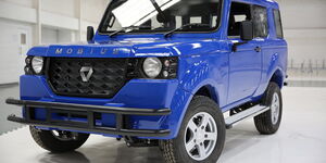 A photo of Mobius motors SUV, third model in a showroom.