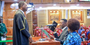 Speaker of the National Assembly Moses Wetangula(left) swearing in newly elected Member of Parliament of Mbeere North Leonard Wamuthende