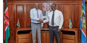 Prime Cabinet Secretary Musalia Mudavadi Shakes Hands with Public Service CS Moses Kuria on January 8