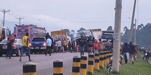 Motorists and residents near a road accident in Kericho on Friday June 30, 2023