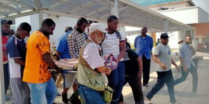 Mourners in Mombasa carry the remains of the late journalist Fatma Rajad.