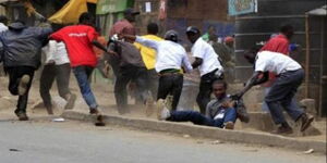 An Image of city residents in running battles with the police.