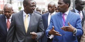 Agriculture CS Peter Munya and Deputy President William Ruto engage in a conversation in a past event