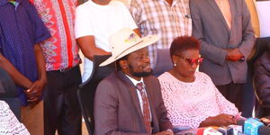 A photo of Meru Governor Kawira Mwangaza (right) and her husband Murega Baichu speaking to the media on January 19, 2024.