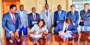 An image of Transport CS Kipchumba Murkomen with his counterpart Roads PS Eng. Joseph Mbugua overseeing the signing of the Ksh.3,2B loan on January 23, 2023