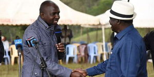 Azimio Leader Raila Odinga (right) shakes hands with Transport CS Kipchumba Murkomen at a function in Elgeyo Marakwet in 2019. 