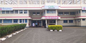 Medical officers and other people at the entrance of Nairobi Women's Hospital