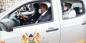 Kitui Governor Charity Ngilu (driving) with President Uhuru Kenyatta (passenger seat) at KICC on November 3, 2020.