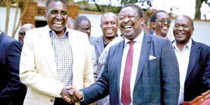 Trader Nginyo Kariuki (left) with ANC leader Musalia Mudavadi at the former’s Rironi home in Kiambu, in 2019 