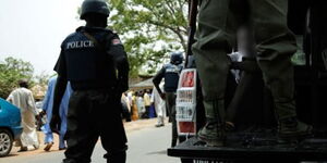 Nigerian police officers arresting a suspect in Abuja in December 2021. 