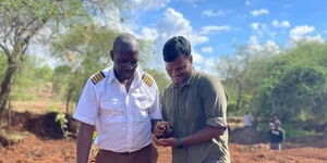 NGO Founder Nimal Raghavan (right) plants a tree in Kenya on April 6, 2023.